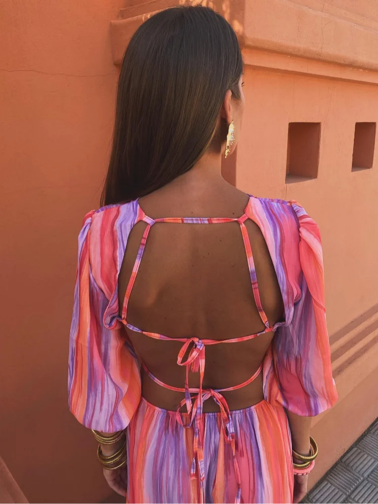 Sola – twilight grace with an open-back allure